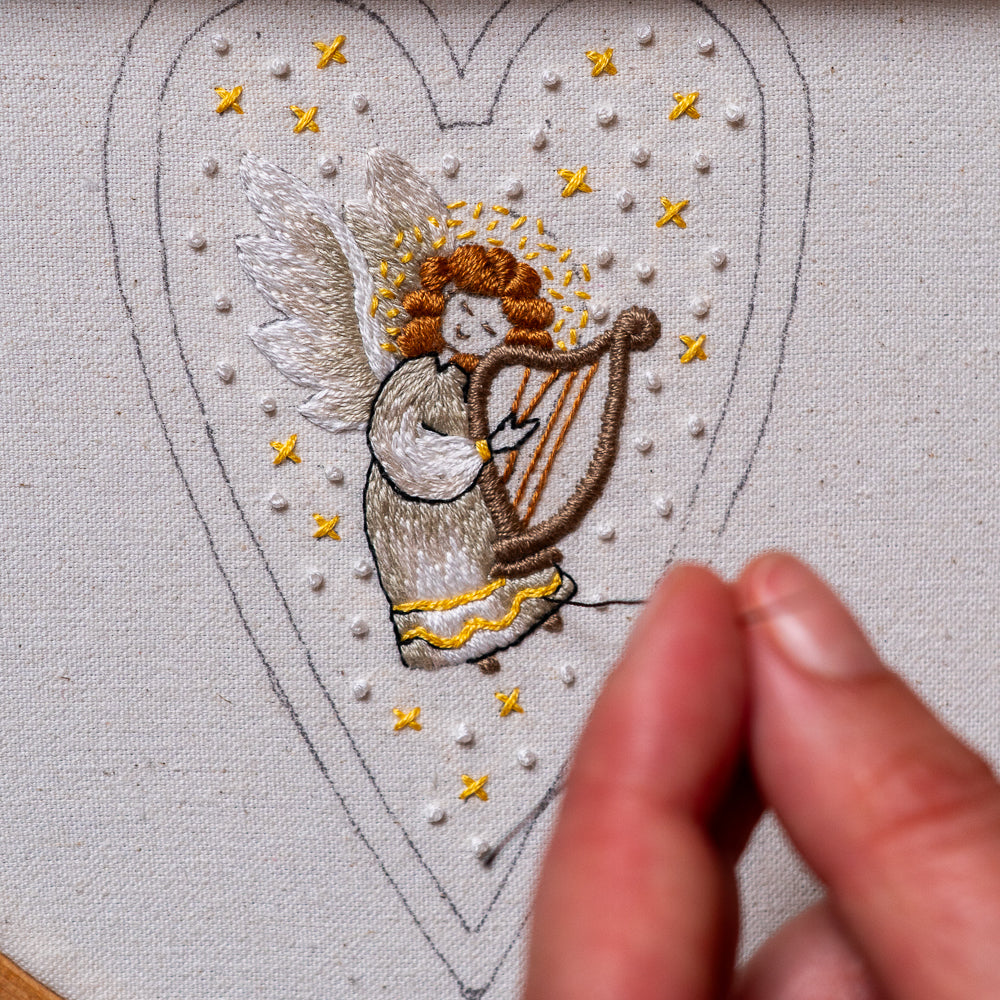 Hand embroidered angel playing a harp Christmas heart ornament